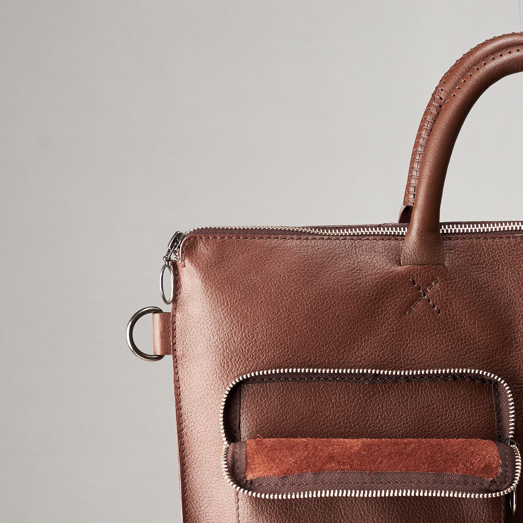 Front pocket suede detail. Brown tote zipper bag by Capra Leather. Handmade men work bag.