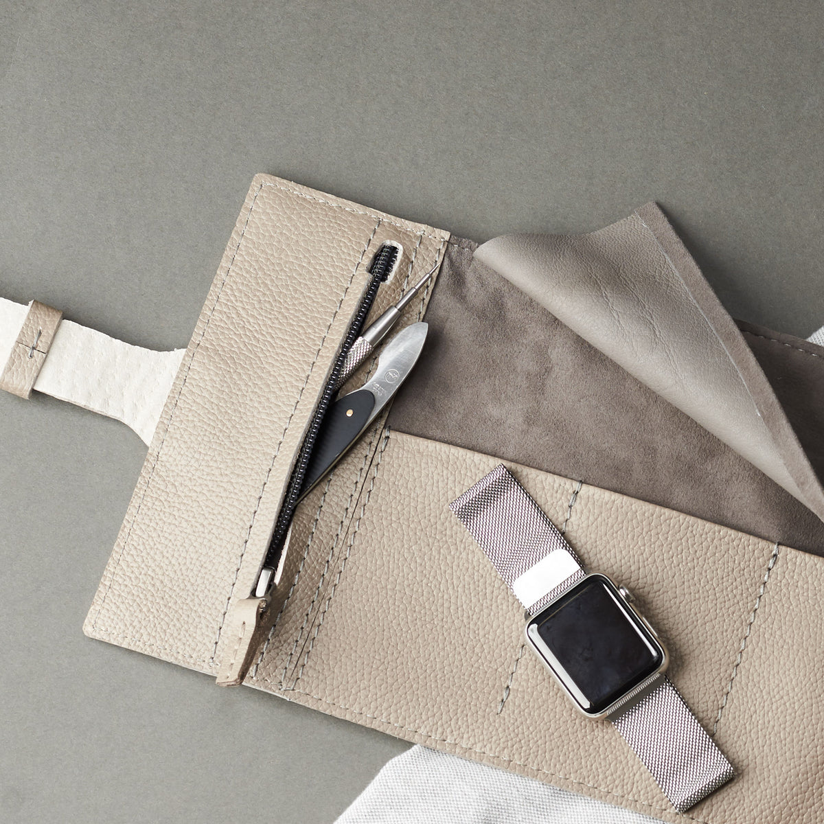 Fahys watch case.  Watch strap roll grey