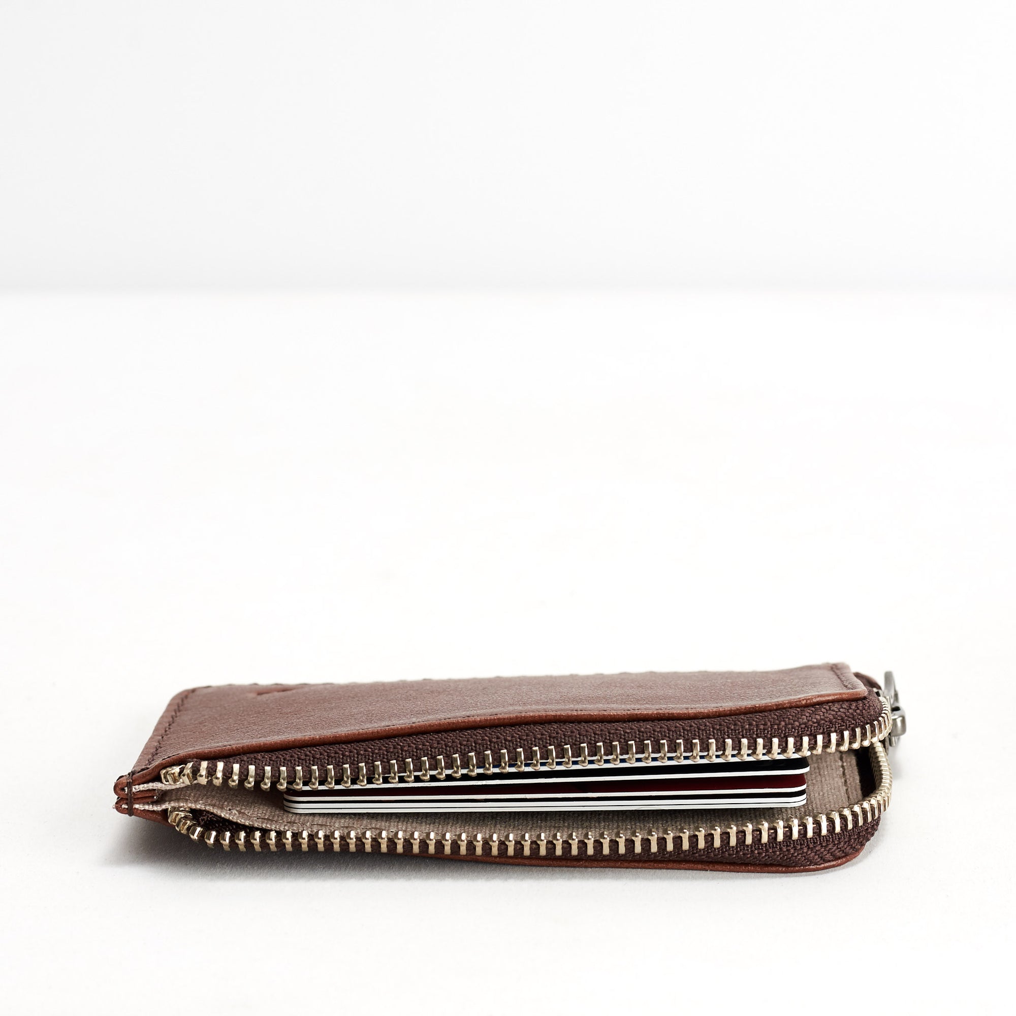 Slim profile. Minimalist brown zipper card holder. Men's bills and coins wallet. Slim designer credit cards holder