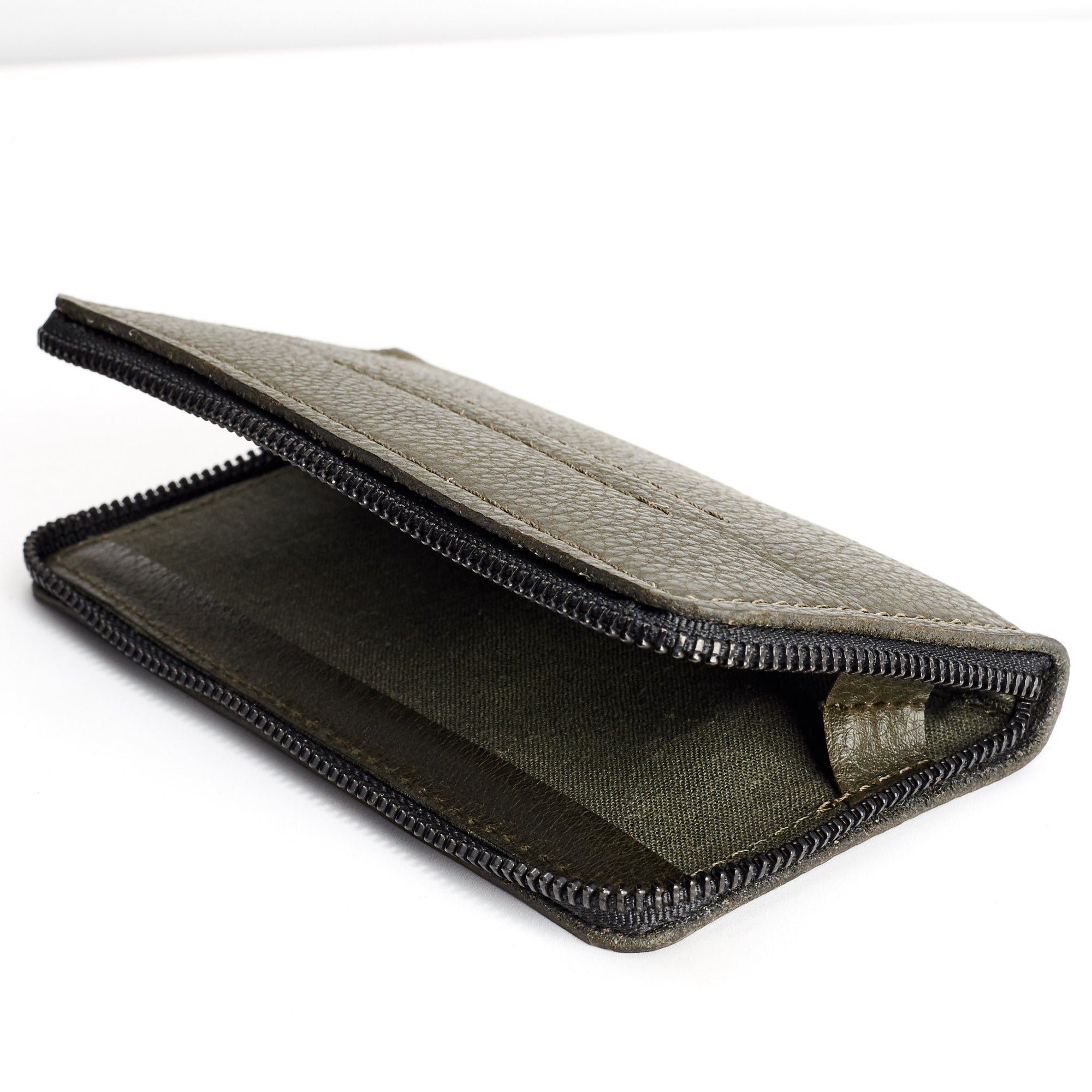 Detail linen interior. Green iPhone leather wallet stand case for mens gifts