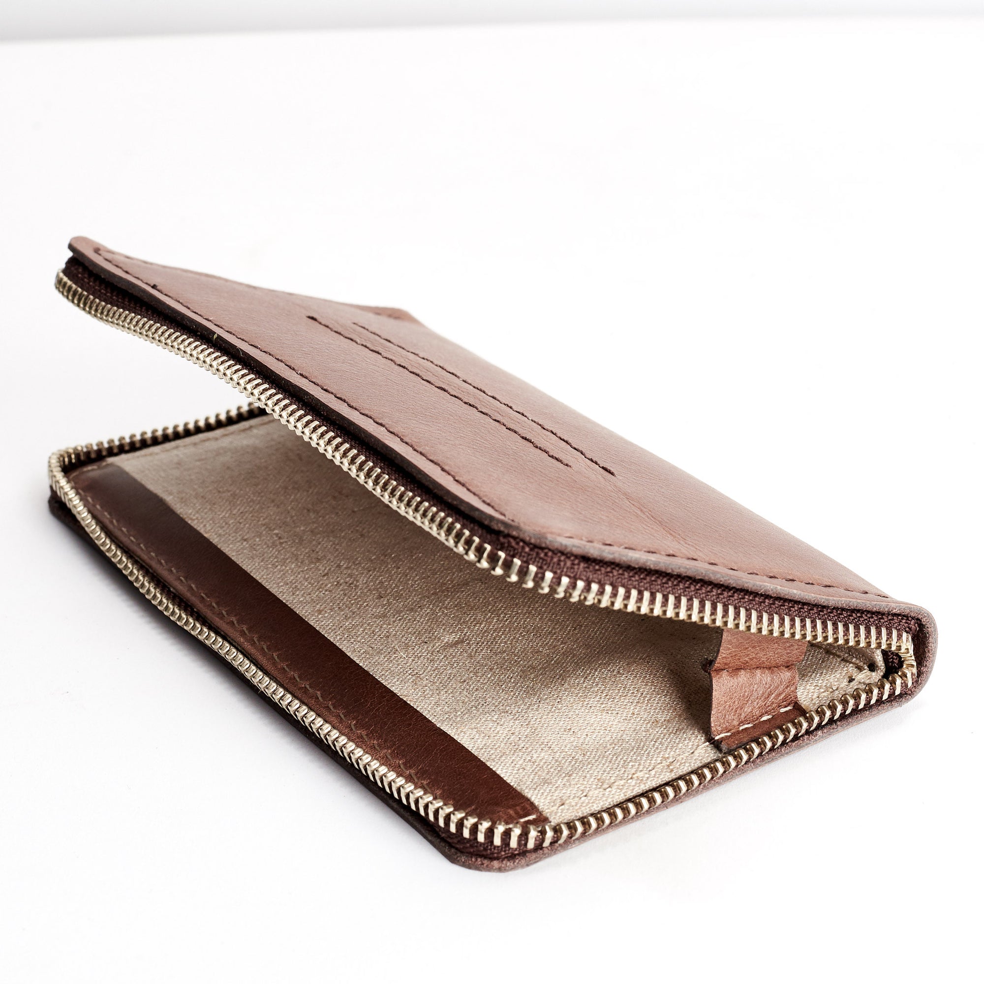 Detail linen interior. Brown iPhone leather wallet stand case for mens gifts.  iPhone x, iPhone 10, iPhone 8 plus leather stand sleeve