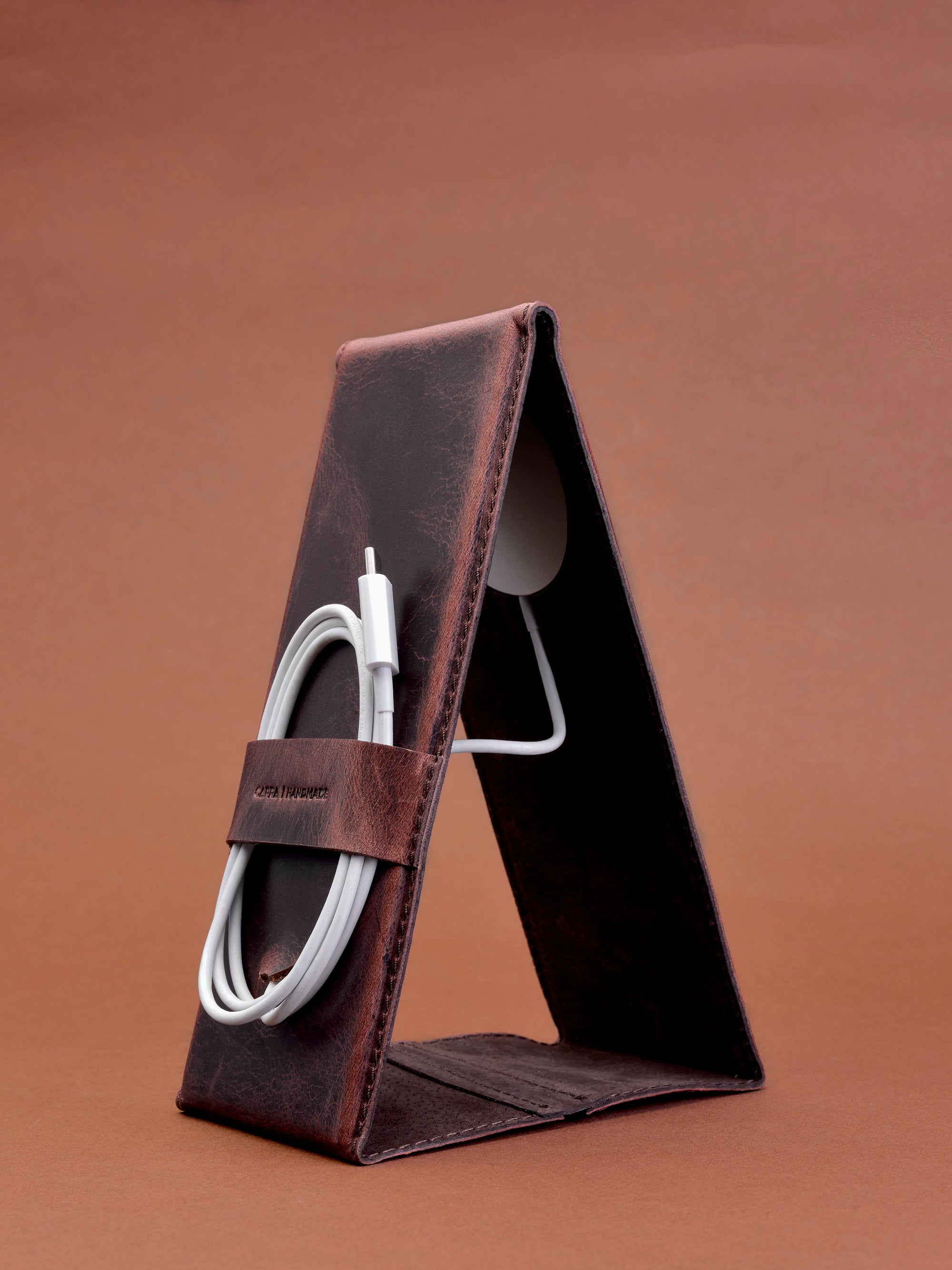 Easy to carry with MagSafe Charger inside. MagSafe iPhone Holder Stand Distressed Cognac by Capra Leather