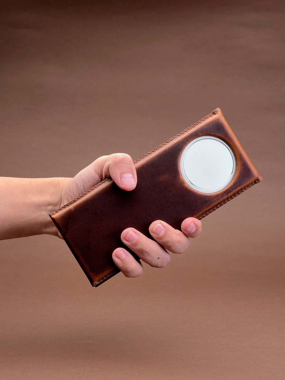iPhone with MagSafe phone stand. MagSafe iPhone Holder Stand Distressed Tan by Capra Leather