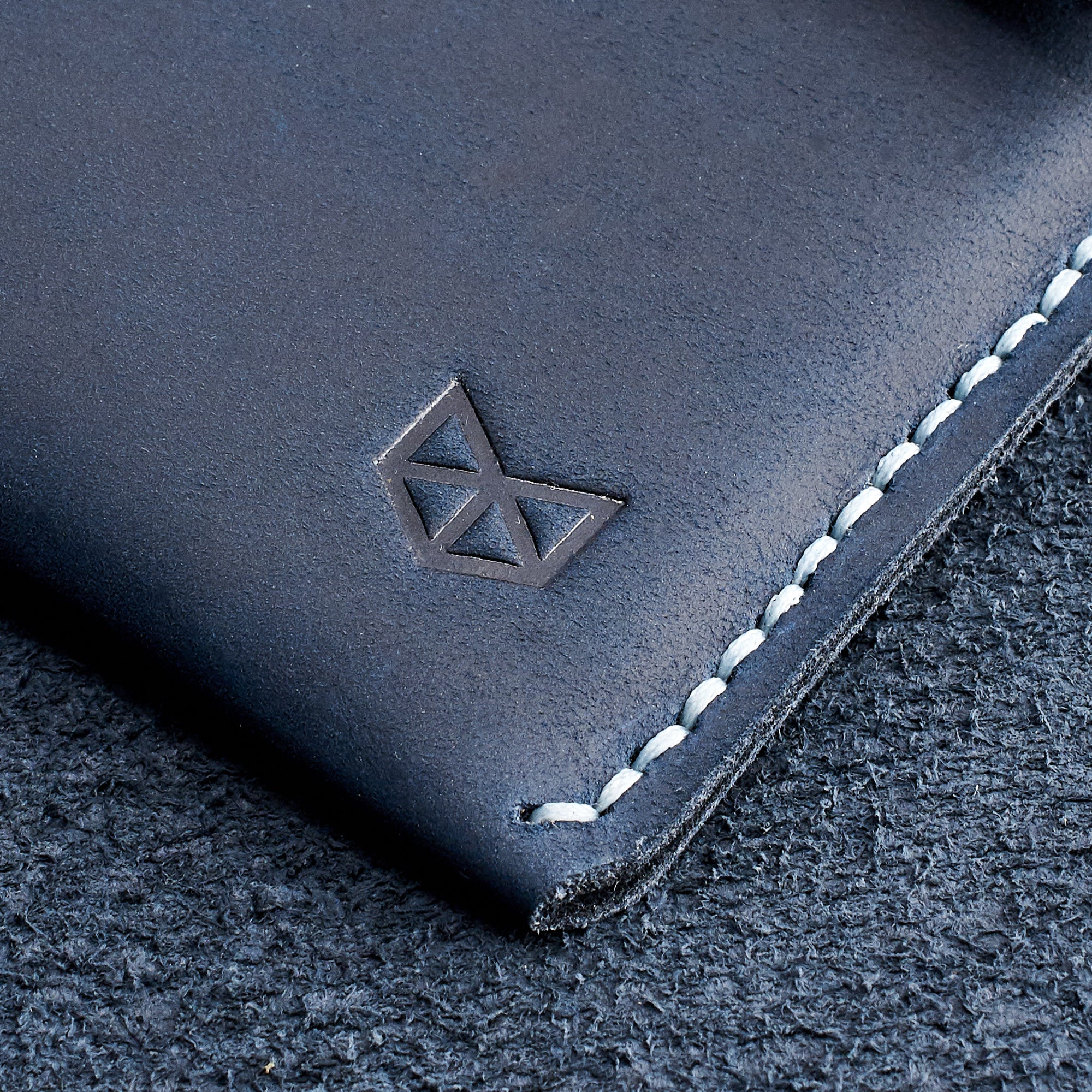 Capra logo detail. Blue handcrafted leather reMarkable tablet case. Folio with Marker holder